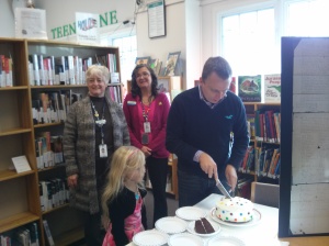 Daughter Lane is among the first for cake while Councillor Scott Moffatt serves up; staffers Karen Craig and Louise Drouin-Backs look on